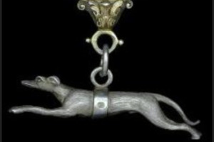 Photo of silver greyhound figurine hanging from the Badge of Office.